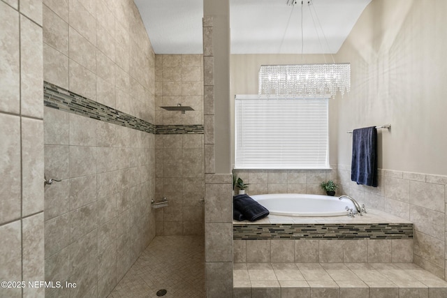 117 S Durbin Pkwy, Saint Johns, FL 32259 - bathroom with a bath, a chandelier, and a tile shower