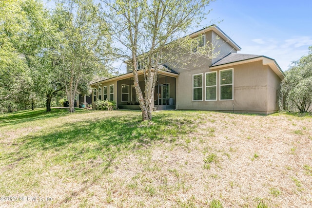 117 S Durbin Pkwy, Saint Johns, FL 32259 - back of house with a lawn and a sunroom