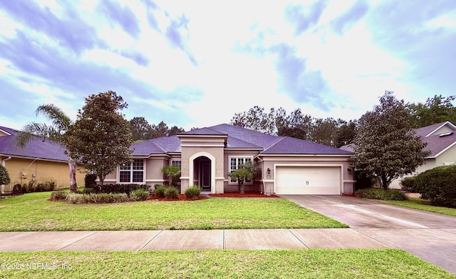 117 S Durbin Pkwy, Saint Johns, FL 32259 - view of front of house featuring stucco siding, an attached garage, driveway, and a front yard