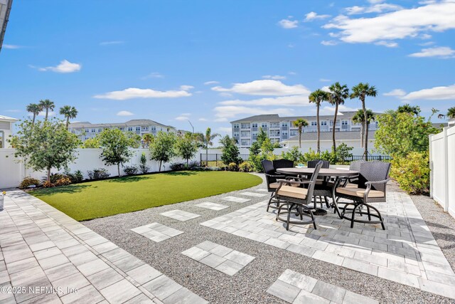329 Rum Runner Way, Saint Johns, FL 32259 - view of patio featuring outdoor dining area and a residential view