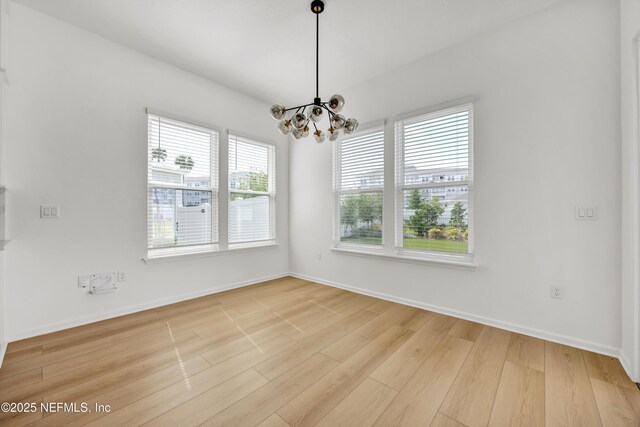 329 Rum Runner Way, Saint Johns, FL 32259 - unfurnished room featuring a chandelier, wood finished floors, and baseboards