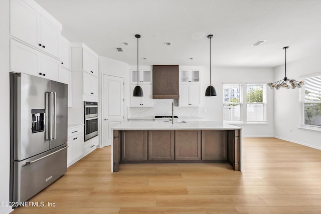 329 Rum Runner Way, Saint Johns, FL 32259 - kitchen featuring appliances with stainless steel finishes, light wood-style floors, light countertops, white cabinetry, and recessed lighting