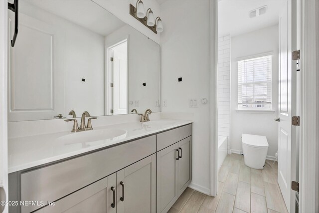 329 Rum Runner Way, Saint Johns, FL 32259 - full bathroom with double vanity, toilet, baseboards, and  shower combination