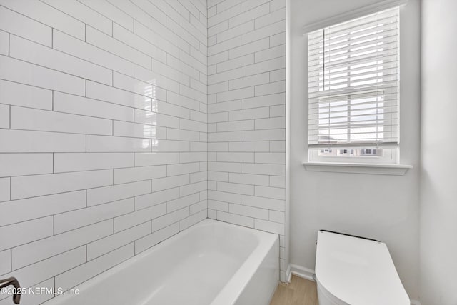 329 Rum Runner Way, Saint Johns, FL 32259 - bathroom with healthy amount of natural light, toilet, tub / shower combination, and baseboards