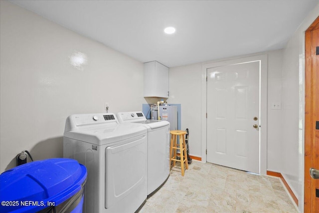 381 Bird Rd, Jacksonville, FL 32218 - laundry room featuring washing machine and dryer, baseboards, and water heater