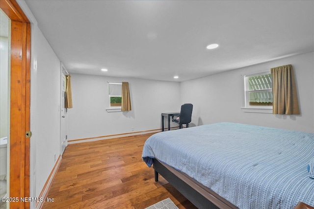 381 Bird Rd, Jacksonville, FL 32218 - bedroom featuring wood finished floors, recessed lighting, multiple windows, and baseboards