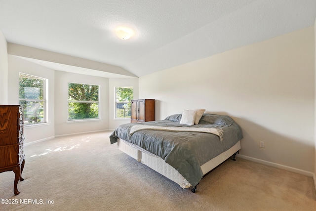 372 Johns Creek Pkwy, Saint Augustine, FL 32092 - carpeted bedroom featuring baseboards and lofted ceiling