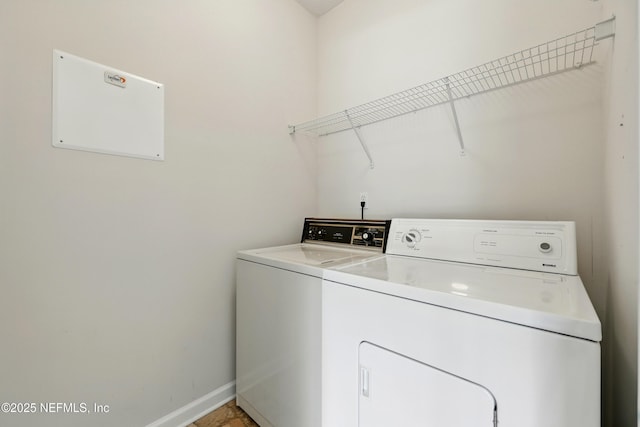 372 Johns Creek Pkwy, Saint Augustine, FL 32092 - washroom featuring washer and clothes dryer and baseboards