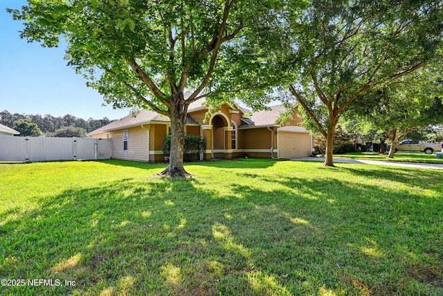 372 Johns Creek Pkwy, Saint Augustine, FL 32092 - view of front of house featuring stucco siding, an attached garage, and a gate