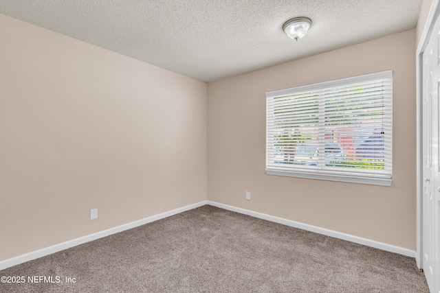 3916 Corrida Ct Unit 5, Jacksonville, FL 32217 - empty room with carpet flooring and a textured ceiling