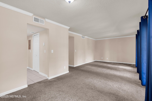 3916 Corrida Ct Unit 5, Jacksonville, FL 32217 - carpeted empty room with ornamental molding, a textured ceiling, and tile patterned floors