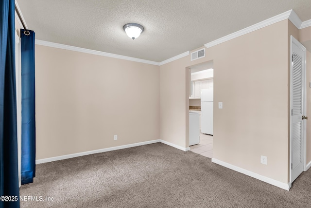 3916 Corrida Ct Unit 5, Jacksonville, FL 32217 - empty room with ornamental molding, light colored carpet, a textured ceiling, and washer / dryer