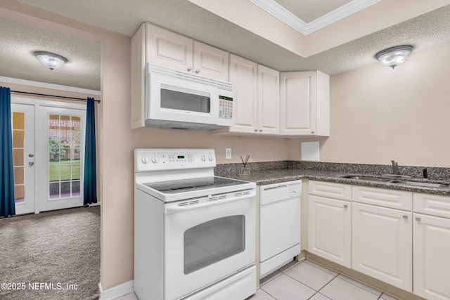 3916 Corrida Ct Unit 5, Jacksonville, FL 32217 - kitchen featuring white appliances, crown molding, white cabinets, a textured ceiling, and dark countertops