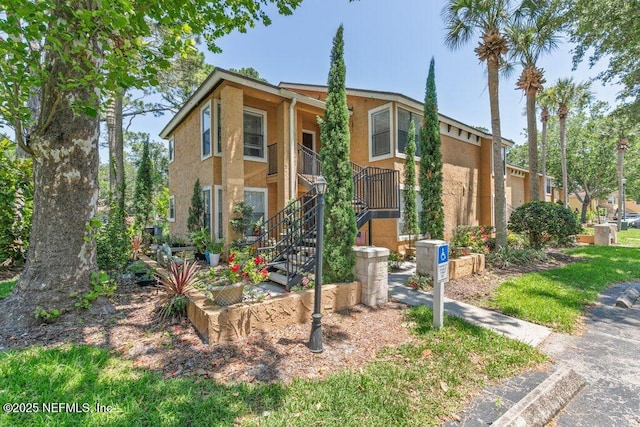 833 Shoreline Cir, Ponte Vedra Beach, FL 32082 - view of front of house with stucco siding and stairway
