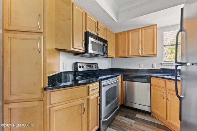 833 Shoreline Cir, Ponte Vedra Beach, FL 32082 - kitchen with appliances with stainless steel finishes, ornamental molding, dark wood-style floors, light brown cabinets, and dark stone counters