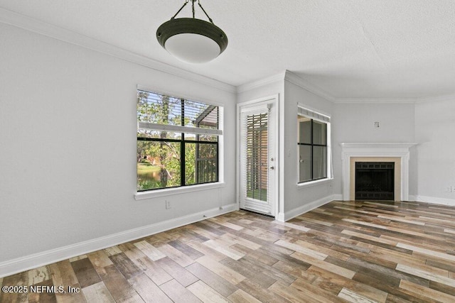 833 Shoreline Cir, Ponte Vedra Beach, FL 32082 - unfurnished living room with wood finished floors, ornamental molding, a fireplace, baseboards, and a textured ceiling