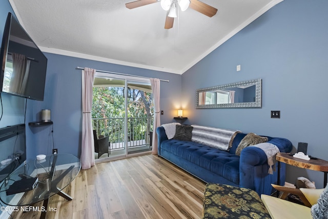 13808 Herons Landing Way Unit 8, Jacksonville, FL 32224 - living room with ornamental molding, vaulted ceiling, wood finished floors, and ceiling fan