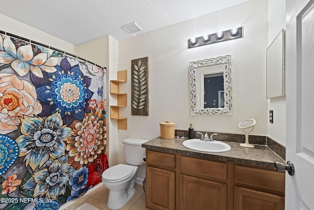 13808 Herons Landing Way Unit 8, Jacksonville, FL 32224 - bathroom with vanity, tile patterned flooring, toilet, a textured ceiling, and a shower with shower curtain
