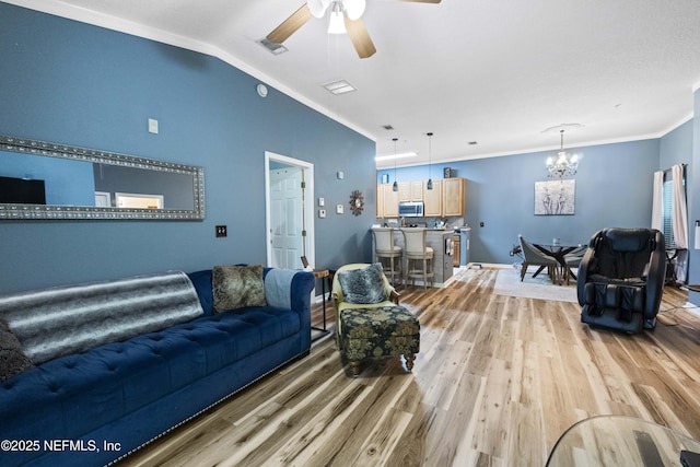 13808 Herons Landing Way Unit 8, Jacksonville, FL 32224 - living room featuring a chandelier, light wood-style flooring, a ceiling fan, ornamental molding, and baseboards