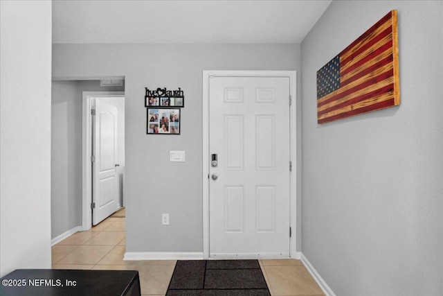86815 Iron Rail Ct, Yulee, FL 32097 - entryway featuring light tile patterned floors and baseboards