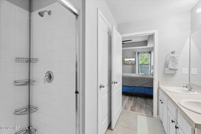 86815 Iron Rail Ct, Yulee, FL 32097 - ensuite bathroom with double vanity, a shower stall, and tile patterned flooring