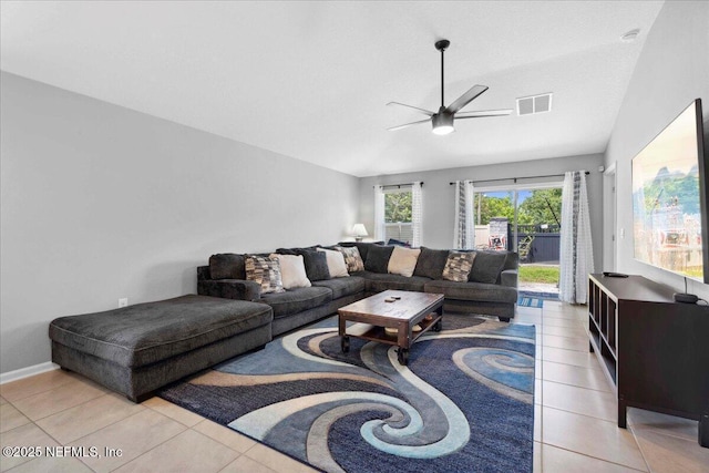 86815 Iron Rail Ct, Yulee, FL 32097 - living area featuring vaulted ceiling, ceiling fan, light tile patterned flooring, and baseboards