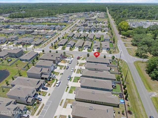86815 Iron Rail Ct, Yulee, FL 32097 - aerial overview of property's location with nearby suburban area, a heavily wooded area, and a nearby body of water