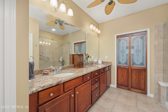 11889 Surfbird Cir Unit 10F, Jacksonville, FL 32256 - full bathroom with a ceiling fan, double vanity, a stall shower, and tile patterned floors