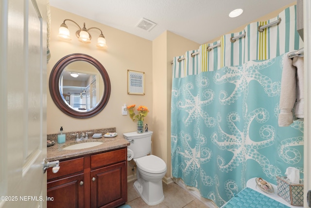 11889 Surfbird Cir Unit 10F, Jacksonville, FL 32256 - full bath with vanity, toilet, tile patterned floors, and a shower with shower curtain