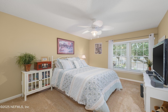 11889 Surfbird Cir Unit 10F, Jacksonville, FL 32256 - bedroom featuring light colored carpet, baseboards, and ceiling fan
