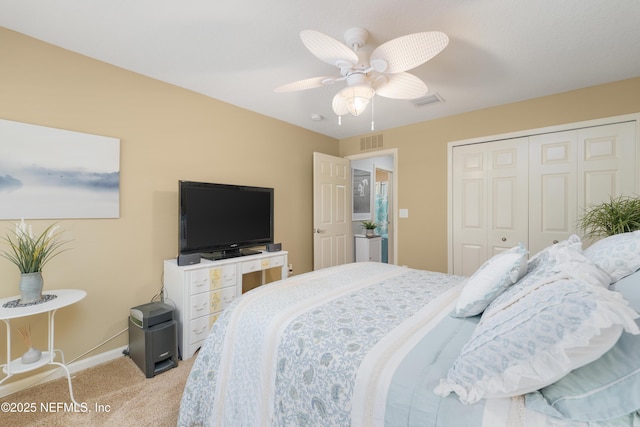 11889 Surfbird Cir Unit 10F, Jacksonville, FL 32256 - bedroom featuring light carpet, a closet, baseboards, and ceiling fan