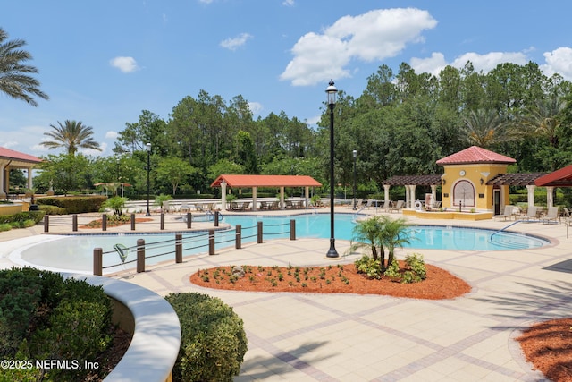 11889 Surfbird Cir Unit 10F, Jacksonville, FL 32256 - community pool with a gazebo, a pergola, and a patio