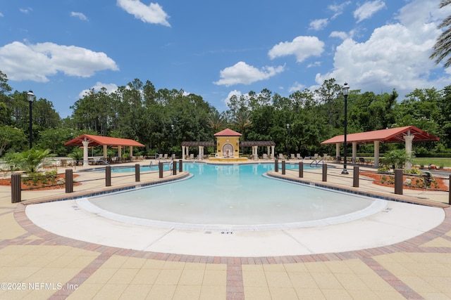 11889 Surfbird Cir Unit 10F, Jacksonville, FL 32256 - community pool featuring a gazebo, view of scattered trees, and a patio area