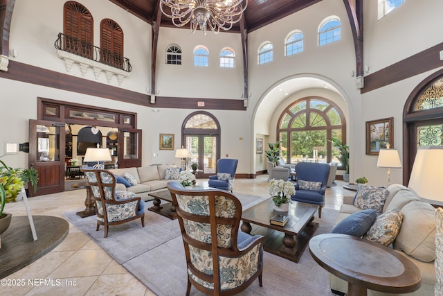 11889 Surfbird Cir Unit 10F, Jacksonville, FL 32256 - living room with a towering ceiling, a chandelier, healthy amount of natural light, and wood ceiling