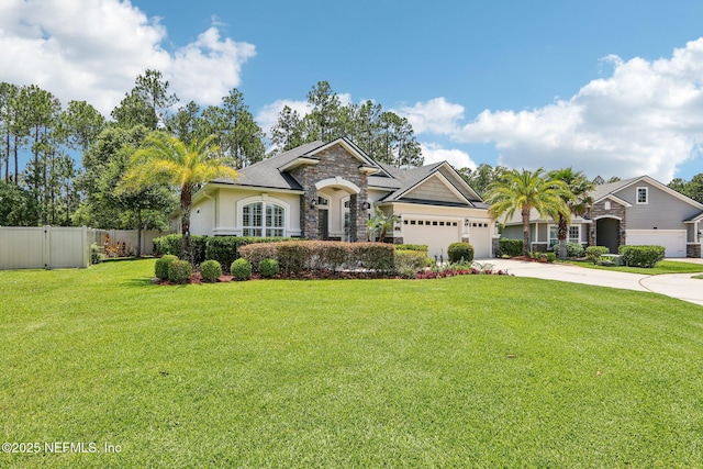 33 Tinker Ct, Fruit Cove, FL 32259 - view of front of house featuring stone siding, driveway, a garage, and stucco siding