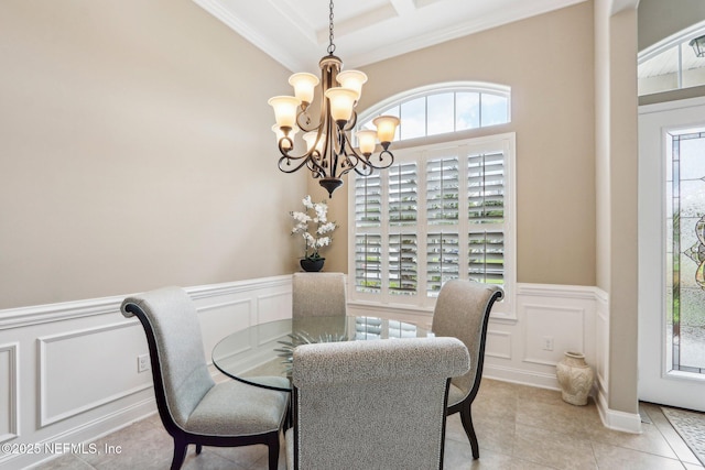 33 Tinker Ct, Fruit Cove, FL 32259 - dining space with a decorative wall, a chandelier, crown molding, a wainscoted wall, and light tile patterned flooring