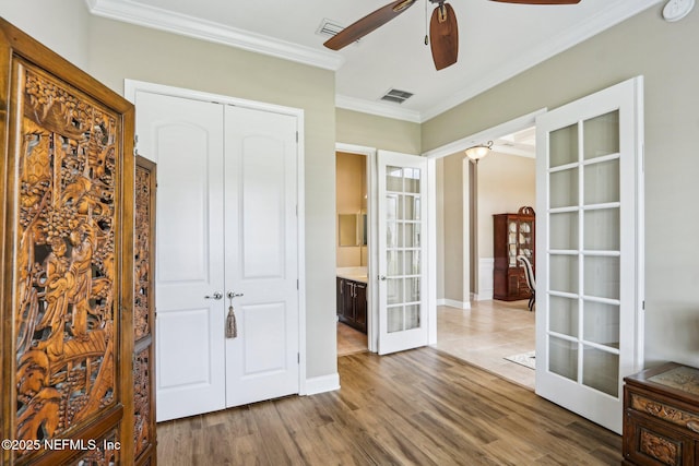 33 Tinker Ct, Fruit Cove, FL 32259 - unfurnished bedroom featuring french doors, crown molding, a closet, wood finished floors, and ceiling fan