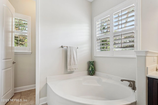 33 Tinker Ct, Fruit Cove, FL 32259 - bathroom featuring a garden tub, vanity, and tile patterned flooring