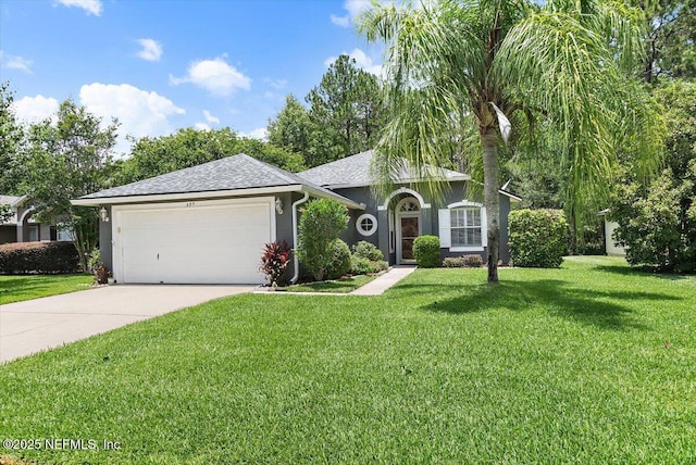589 Prosperity Lake Dr, Saint Augustine, FL 32092 - view of front of home featuring a front lawn, an attached garage, concrete driveway, a shingled roof, and stucco siding