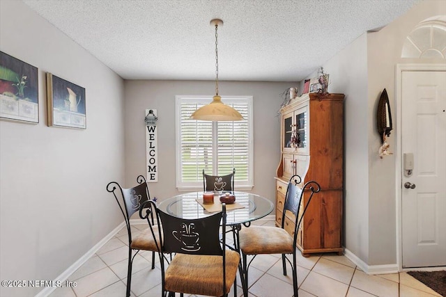 589 Prosperity Lake Dr, Saint Augustine, FL 32092 - dining space with a textured ceiling, light tile patterned floors, and baseboards