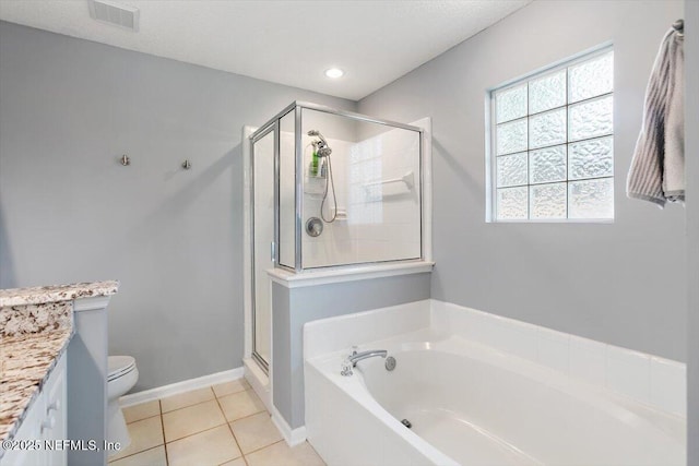 589 Prosperity Lake Dr, Saint Augustine, FL 32092 - full bathroom with a garden tub, vanity, a shower stall, toilet, and tile patterned flooring