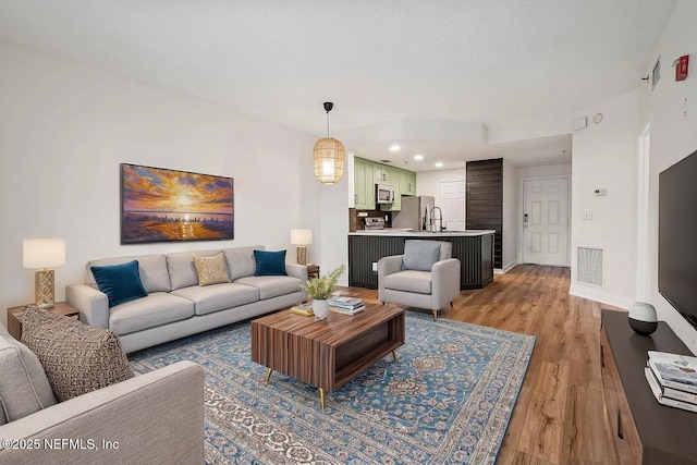 12 Flagler Blvd Unit A203, Saint Augustine, FL 32080 - living area with light wood-style floors, baseboards, and recessed lighting