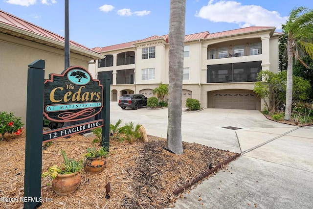 12 Flagler Blvd Unit A203, Saint Augustine, FL 32080 - community sign with concrete driveway and an attached garage