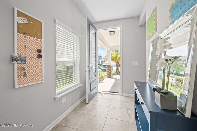 149 Ferndale Way, Saint Augustine, FL 32092 - doorway to outside with baseboards and light tile patterned floors