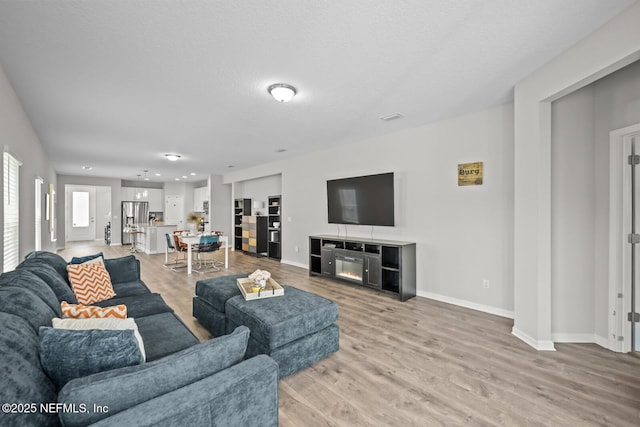 149 Ferndale Way, Saint Augustine, FL 32092 - living area featuring light wood finished floors and baseboards
