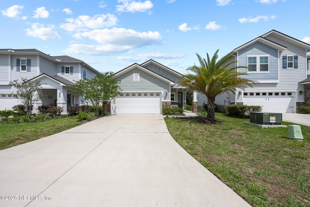 149 Ferndale Way, Saint Augustine, FL 32092 - view of front of home with driveway, a front yard, an attached garage, and stone siding