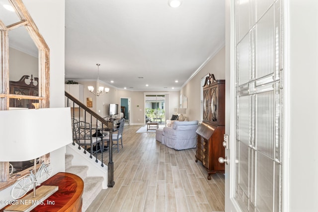 121 Thistleton Way, Saint Augustine, FL 32092 - entryway featuring stairs, a chandelier, crown molding, recessed lighting, and light wood-type flooring