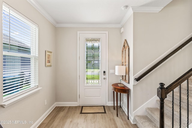 121 Thistleton Way, Saint Augustine, FL 32092 - entryway with crown molding, light wood finished floors, stairs, and baseboards