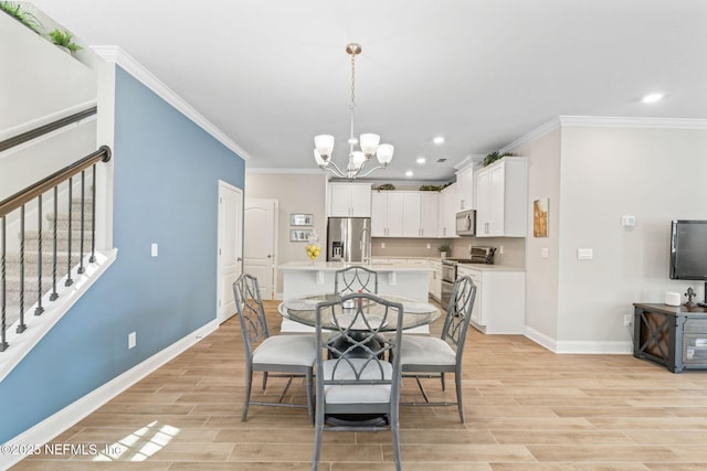 121 Thistleton Way, Saint Augustine, FL 32092 - dining space with baseboards, recessed lighting, crown molding, a chandelier, and light wood-type flooring