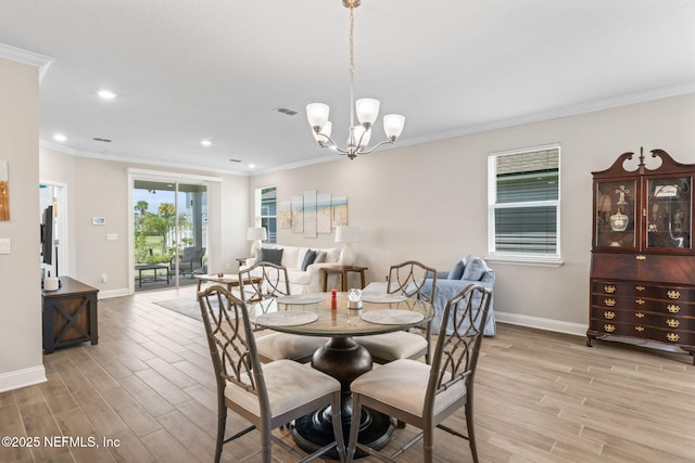 121 Thistleton Way, Saint Augustine, FL 32092 - dining area featuring light wood-style flooring, ornamental molding, baseboards, recessed lighting, and a chandelier